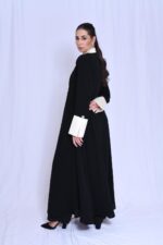 An elegant black blazer featuring white taffeta sleeves and collar. - Image 4