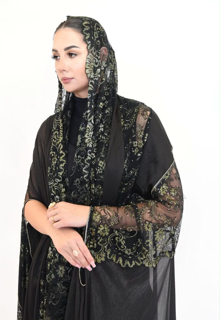 WhatsApp Image 2026-07-29 at 6.09.38 PM A luxurious black and gold lace abaya featuring shimmering foil chiffon. - Image 1