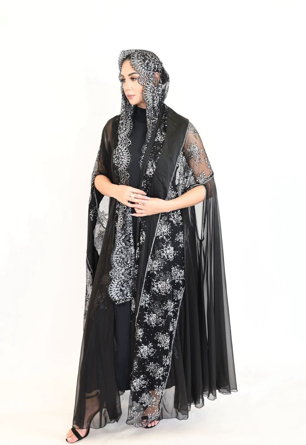 WhatsApp Image 2026-07-29 at 6.16.50 PM A luxurious abaya featuring premium silver and black lace combined with shimmering foil chiffon. - Image 1