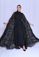 A special-occasion abaya made of tulle and embellished with luxurious crystals; includes a matching shayla for an elegant look.