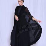 Pleated chiffon with a cape-style cut.